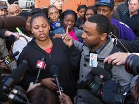 Nailah Winkfield, the mother of Jahi McMath, along with Jahi's uncle Omari Sealy (R), speak with the media outside Children's Hospital and Research Center in Oakland, California, December 30, 2013. (REUTERS/Norbert von der Groeben)