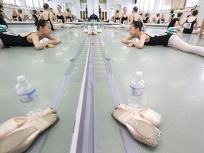 Do Yoon Kim stretches in front of a mirror before an audition for Canada?s National Ballet School at Dance Steps Studio in London Monday. About 150 dancers will earn spots at the school?s full-time professional ballet program, with over 1,000 hopefuls trying out at 20 audition stops coast-to-coast. (CRAIG GLOVER, The London Free Press)