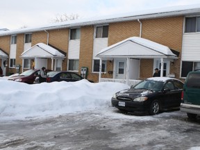 A young woman sought refuge at this row unit at 980 Cummings Ave. Sunday afternoon after being shot in the leg by a man at a building across the street. Mitch Kalil, 31, is wanted by police for attempted murder. He is believed to be in the Montreal area. 
Doug Hempstead/Ottawa Sun