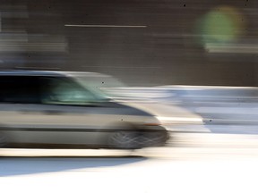 A vehicle navigates an intersection in Winnipeg, Man. Monday Jan. 6, 2014. (Brian Donogh/Winnipeg Sun)