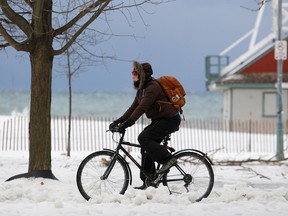 A cyclist is pictured in Toronto on Monday. (CRAIG ROBERTSON, Toronto Sun)