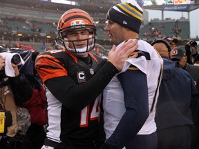 Bengals QB Andy Dalton (left) and Chargers QB Philip Rivers shake hands after Sunday's game. (USA TODAY SPORTS)
