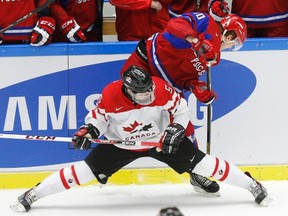 Junior stars like Aaron Eckblad, shown here at the World Junior Championship, are increasingly attainable at the draft for bottom-of-the-league Oilers, leading GM Craig MacTavish to reconsider his pre-season stance. (Reuters)