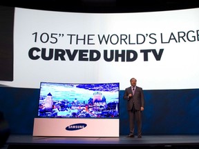 Joe Stinziano, executive vice president of Samsung Electronics of America, introduces a 105-inch, curved UHD television during the Consumer Electronics Show (CES), in Las Vegas, Jan. 6, 2014. REUTERS/Steve Marcus