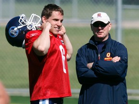 Pat Tracey (right), seen here speaking with then-Argos QB Danny Brannagan in 2010, has been hired as the Bombers' new special-teams co-ordinator. (MICHAEL PEAKE/QMI AGENCY FILE PHOTO)
