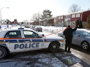 Gatineau police continue to investigate a house at 158 Terrasse Eardley in Alymer, Que., on Tuesday January 7, 2014, where Amanda Trottier and Travis Votour were found dead Monday. Darren Brown/Ottawa Sun
