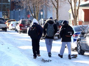 Pedestrians heading to Queen's University for class walk along a narrow Aberdeen Street in Kingston on Tuesday.
IAN MACALPINE/KINGSTON WHIG-STANDARD/QMI AGENCY