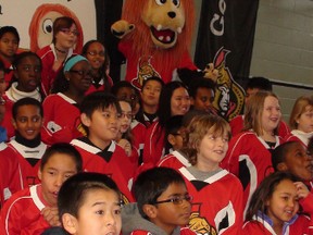 Students from St. Rose of Lima took part in a press conference Tuesday announcing a new rink at Bayshore Park on Tues. Jan. 7, 2014. Set to open by summer and converted to a basketball court, it's a joint project by the Ottawa Senators Foundation, Ferguslea Properties and City of Ottawa. Kelly Roche/Ottawa Sun