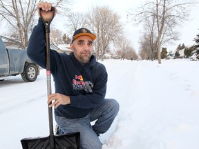 St. Vital resident Billy Puddicombe stands on his street in Winnipeg, Man. Tuesday Jan. 7, 2014. Puddicombe is upset that the snow clearing in his area has been delayed again. (Brian Donogh/Winnipeg Sun)