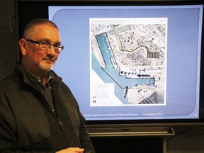 Peter Hungerford, director of economic development and corporate planning with the City of Sarnia, stands by a map of Sarnia Harbour. Several people attended an open house at City Hall Tuesday to weigh in on the city potentially taking ownership of the harbour from the federal government. TYLER KULA/ THE OBSERVER/ QMI AGENCY