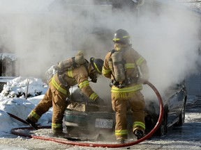 London firefighters battle a car fire on Second St. north of Dundas St. on Wednesday, January 8, 2014 (MORRIS LAMONT, The London Free Press)
