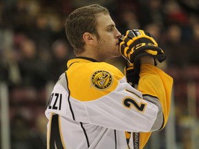 Newly acquired Sarnia Sting defenceman Kevin Spinozzi appears deep in thought prior to first-period action Wednesday at the Essar Centre in Sault Ste. Marie. On Tuesday, the Sting traded second-year forward Bryan Moore and sophomore defenceman Tyler Hore to the Soo Greyhounds for Spinozzi. (Jeffrey Ougler/QMI Agency)