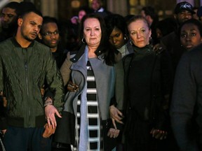 The family of Mark Duggan, (L-R) brother Marlon, mother Pamela and aunt Carol, stand outside the High Court in London on January 8, 2014. (REUTERS/Stefan Wermuth)