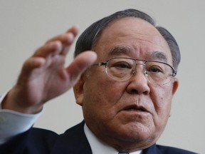 Canon Inc chairman and CEO Fujio Mitarai speaks during an interview with Reuters at the company's headquarters in Tokyo, Jan. 9, 2014.  REUTERS/Yuya Shino