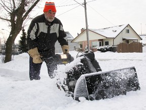 Tom Chlebowski, 63, clears the Point Edward sidewalk near St. Clair and Alexandra. He's among a group of village residents who've taken it upon themselves to clear walkways around Point Edward whenever snow hits. Chlebowski's been clearing sidewalks in the village for 10 years and said he was inspired by the late Vic Spina, who started the goodwill gesture years before. TYLER KULA/ THE OBSERVER/ QMI AGENCY
