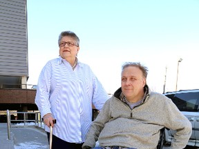 Mary Margaret Dauphinee and Neil Allen of the Independent Living Centre Kingston are affected by the icy conditions in Kingston. 
 IAN MACALPINE/KINGSTON WHIG-STANDARD/QMI AGENCY