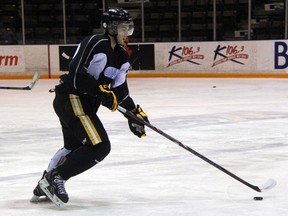 Newly acquired defenceman Kevin Spinozzi lugs the puck up ice at Sarnia Sting practice on Thursday, Jan. 9. The Sting, who are prepping for a game against Plymouth on Friday night, watched the overage player trade deadline pass without making a deal involving either of their 20 year old players. SHAUN BISSON/ THE OBSERVER/ QMI AGENCY