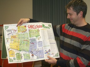 Randall Van Wagner, greening partnership coordinator at the Lower Thames Valley Conservation Authority, poses with a map showing the location of heritage trees in Elgin County. A local group would like to take on a similar project here by cataloging trees of interest.