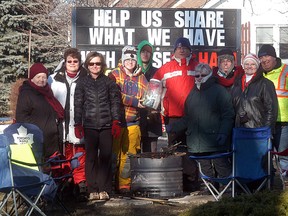 A group spent most of Dec. 27-28 outside of Holy Family church to raise funds for a mission trip they are taking in March to Haiti. The group raised over $3,500 with the funds helping out local charities and their mission trip.