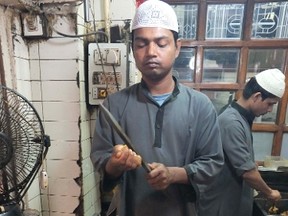 Spicy minced-mutton kebabs, formed around hot iron rods and grilled, are one of the specialties at Karim’s, a Delhi restaurant serving Mughal dishes since 1913. GREG MIDDLETON/MERIDIAN WRITERS' GROUP