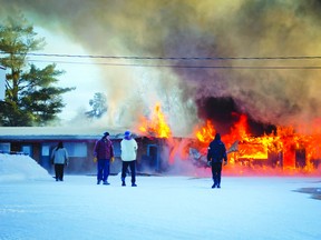 Despite efforts by a hastily assembled group of staff and volunteers, flames quickly spread from a machine shop to engulf the adjacent motel at the Willard Lake Lodge fire on Highway 17 east of Kenora, Monday, Jan. 6.