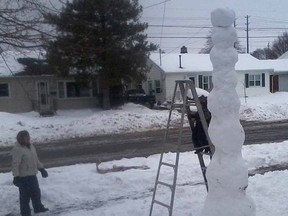 TWO-YEAR-OLD BUILDS FIRST SNOWMAN

Submitted photo
Two-year-old Ben Jackson of Chatham was on a mission Friday morning as he helped build his first snowman. The ladder came in handy. By Friday afternoon, Ben's big snowman had already wilted in as temperatures started to rise. Ben climbs the ladder as a neighbour looks on.