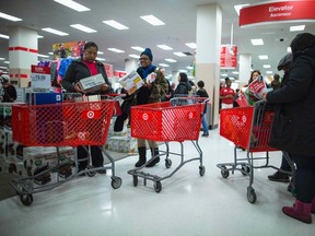 People shop inside a Target store during Black Friday sales in the Brooklyn borough of New York, November 29, 2013. Black Friday, the day following Thanksgiving Day holiday, has traditionally been the busiest shopping day in the United States. REUTERS/Eric Thayer