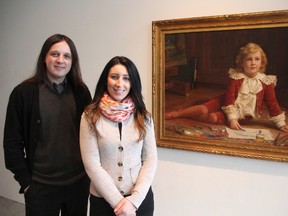 Darryn Doull with the Judith and Norman Alix Art Gallery and the Alzheimer Society's Ileana Rivas, stand with a painting by John Colin Forbes: "Boy in a Studio," (c. 1896), The oil on canvas gift from the Estate of Norman B. Forbes, 1980, was the inspiration for a creative story building exercise during a recent arts workshop at the gallery for people with dementia and memory loss. An exhibit featuring work from the participants, Inspirational Memories, is opening at the gallery this weekend. (TYLER KULA/ THE OBSERVER/ QMI AGENCY)