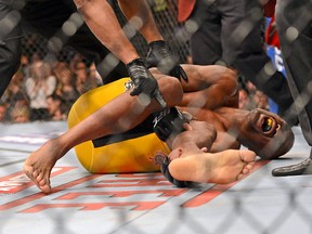 Anderson Silva reacts after breaking his leg on a kick to Chris Weidman (not pictured) during their UFC middleweight championship bout at the MGM Grand Garden Arena on Dec 28, 2013 in Las Vegas, NV, USA. (Jayne Kamin-Oncea-USA TODAY Sports)