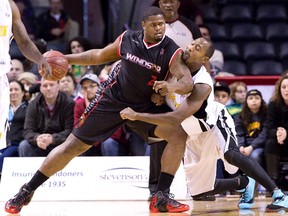 Elvin Mims of the London Lightning, right, defends against Windsor Express player DeAndre Thomas at Budweiser Gardens on New Year?s Day. (Free Press file photo)