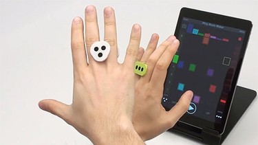 Tired of trying of having to actually have it come into contact with your iOS device to make it work? Try the iRing. Developed by IK Multimedia, the device consists of two rings you slip onto your hands and then you can control your iOS device with the swipe of your hand. For the time being, the device only works with iRing's own music apps, but more programs could be developed in the future. (Video screenshot)