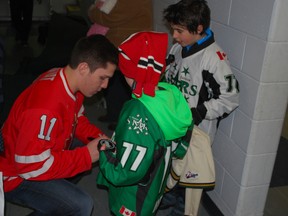 Rodney native Bo Horvat signs autographs for young fans Thursday at the Timken Centre in St. Thomas. Thursday was Bo Horvat Night at the St. Thomas Stars home game against the Strathroy Rockets. (Ben Forrest, Times-Journal)