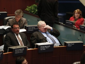 Councillor Giorgio Mammoliti and Mayor Rob Ford at council on Jan. 10. 2014. (Stan Behal/Toronto Sun)