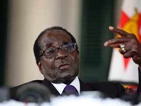 Zimbabwean President Robert Mugabe gestures as he addresses a news conference, after the swearing-in of ministers at the State House in Harare September 11, 2013.
REUTERS/Philimon Bulawayo