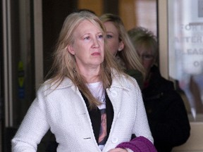 Denise Minderlein, mother of slaying victim Terrell Johnson, leaves court in London Friday after two men were sentenced for their part in her son?s shooting death in Sept. 2012. (DEREK RUTTAN, The London Free Press)