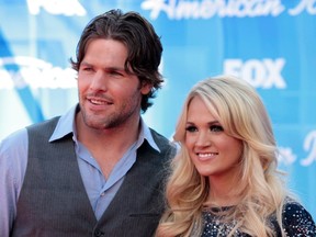 Peterborough native Mike Fisher and his wife country singer Carrie Underwood arrive at the 11th season finale of American Idol in Los Angeles on May 23, 2012. The Nashville Predators player is out for four to six months with an Achilles tendon injury but has recently resumed skating and hopes to be able to play again in November.
REUTERS/Jason Redmond file photo