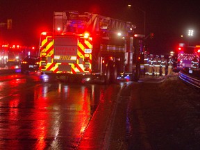 Emergency responders at the scene where a transport carrying formaldehyde crashed on the Hwy. 401 on-ramp in London. MIKE HENSEN / THE LONDON FREE PRESS / QMI AGENCY