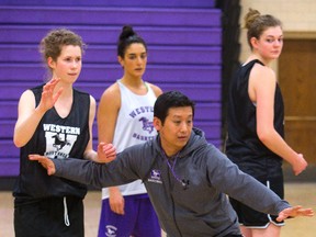 Head coach Brian Cheng directs the Western women?s basketball squad during practice at Thames Hall on Friday.  (MIKE HENSEN, The London Free Press)