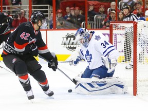 Toronto Maple Leafs goalie James Reimer (34) makes a 1st period save on Carolina Hurricanes forward Brett Sutter (42) at PNC Arena in Raleigh, N.C.. (JAMES GUILLORY/USA TODAY Sports)