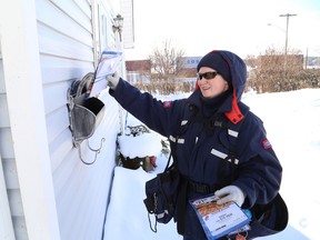 Letter carrier Nancy Legault, of Canada Post, delivers mail in all kinds of weather. JOHN LAPPA/THE SUDBURY STAR/QMI AGENCY