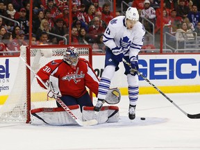 Capitals' Michal Neuvirth makes a save in front of Maple Leafs’ James van Riemsdyk in the first period in Washington last night. (USA Today/photo)