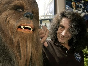 Actor Peter Mayhew gets re-acquainted with his alter-ego, the lovable Chewbacca, at the Disney-MGM Studios in Lake Buena Vista, Florida in this June 6, 2003 file photo. (Reuters files)
