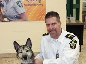 Leland Gordon, chief operating officer at Winnipeg Animal Services, with Dillon, a dog that was later adopted.