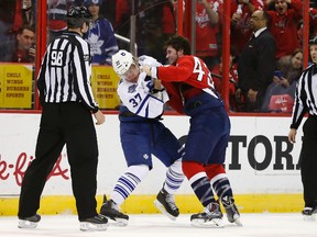 Toronto Maple Leafs right wing Carter Ashton (37) fights with Washington Capitals right wing Tom Wilson (43) in the second period at Verizon Center on Jan. 11. (Geoff Burke-USA TODAY Sports)
