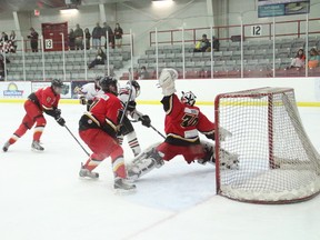 Red Lake goalie Breton Burke goes all out to make the save during their game against the St. Thomas Aquinas Saints on Jan. 11.