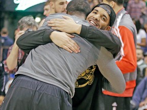 Drake was all smiles and hugs with the Raptors before last night’s game at the ACC. (CRAIG ROBERTSON/Toronto Sun)