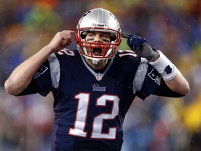 New England Patriot Tom Brady gestures at the line in the second half during the 2013 AFC divisional playoff football game against the Indianapolis Colts at Gillette Stadium. (Mark L. Baer/USA TODAY Sports)
