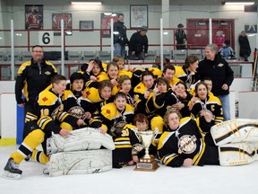 The champions of the 2014 Kenora Thistles AA Bantam Hockey Tournament, the Fort Frances Canadians.