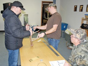 Rolland Vienneau, left, and Jo McLean measured trophies while Duane Mix recorded the measurements during the Vulcan Gun Club/Fish and Game's annual trophy measuring day on Jan. 4 at the Vulcan Legion. The measuring day always leads up to the club's annual wild game supper, which takes place Saturday, Feb. 1 at the Cultural-Recreational Centre.