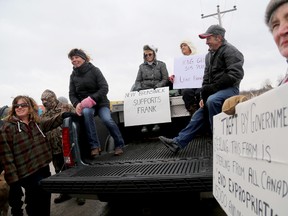 Lisa Gibson (on truck, pink gloves), who started the Facebook page Save Frank and Marjorie Meyers' Farm speaks to supporters of the Meyers while taking part in a demonstration against the expropriation of the Meyers land in January 2014. - 
FILE PHOTO BY EMILY MOUNTNEY/THE INTELLIGENCER/QMI AGENCY